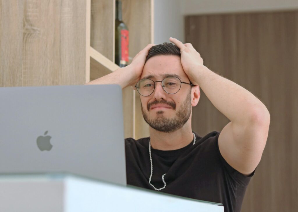 frustrated man using laptop frustrated man using laptop