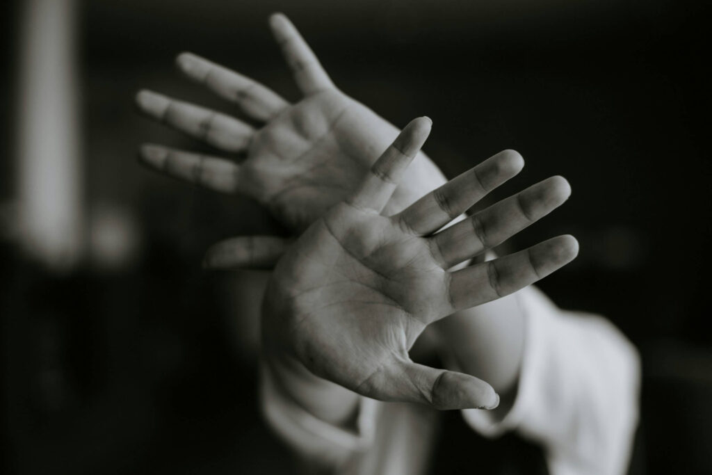 hands covering face