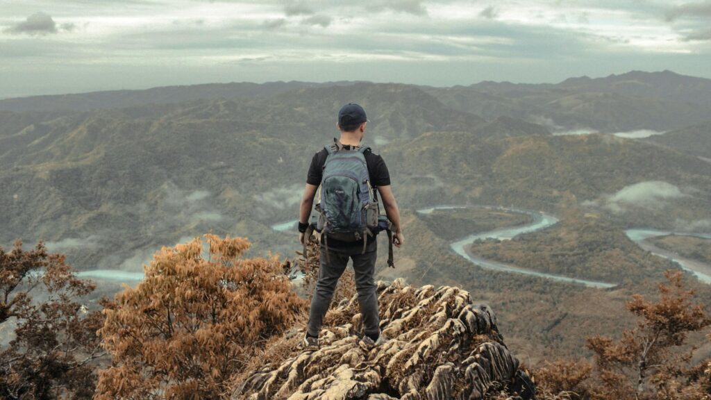 hiker mountain river view