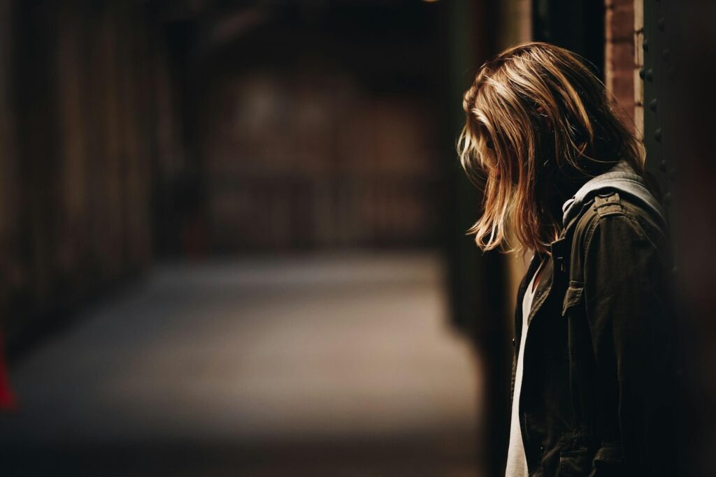 lonely woman dim alley