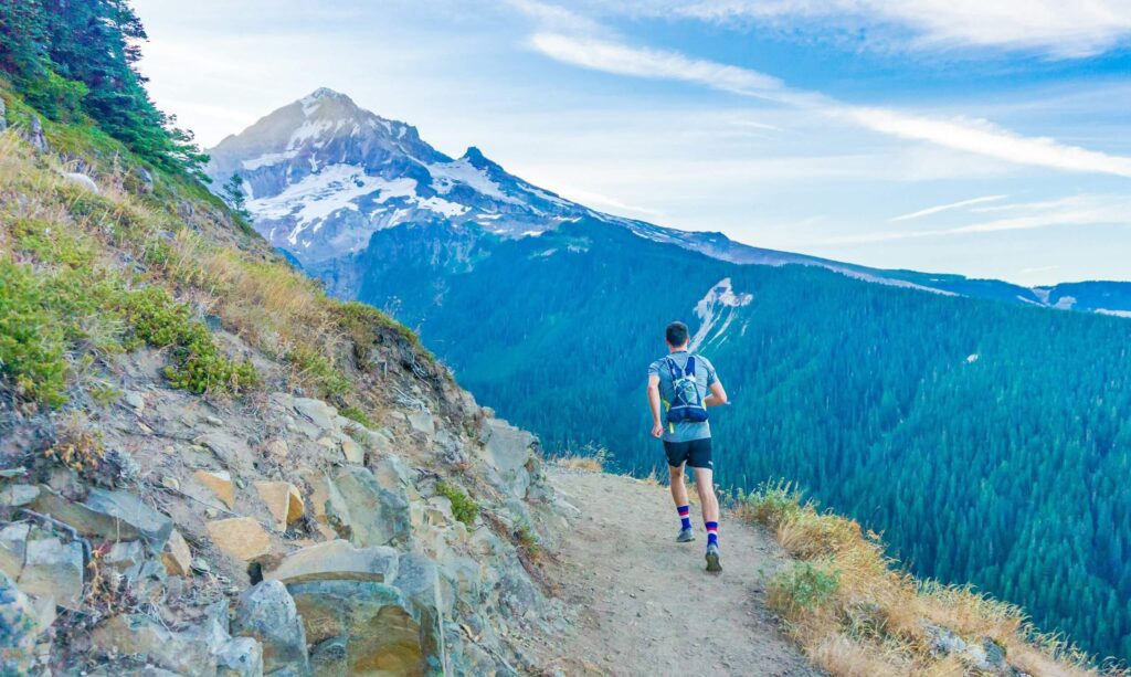 man hiking mountain trail