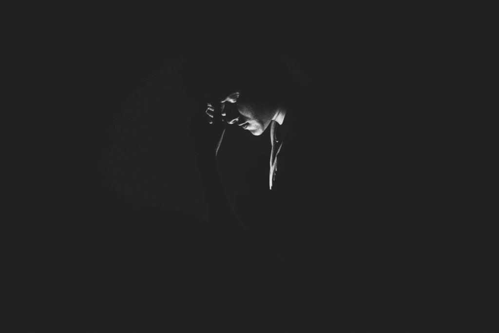 man in deep shadows
