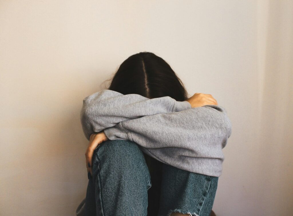 sad girl sitting alone
