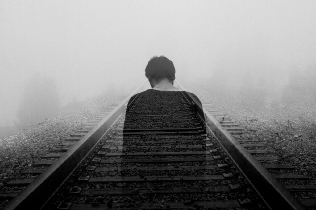 solitary figure railway mist