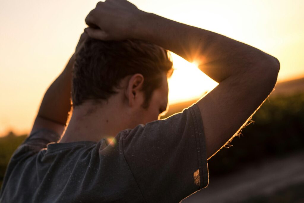 sunset thoughtful young man
